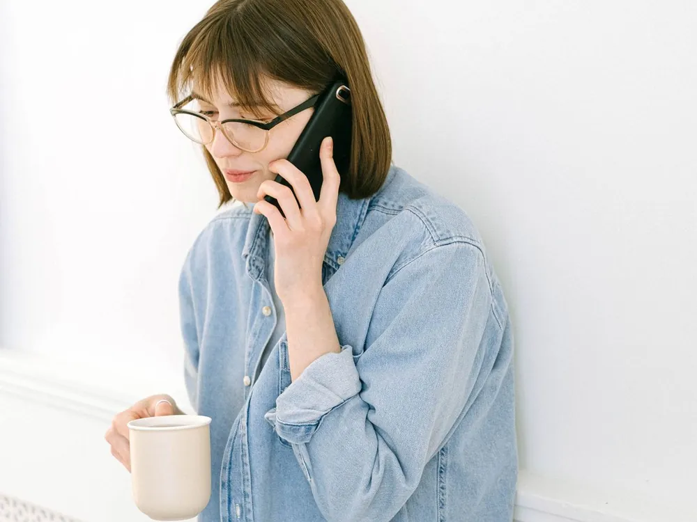 A customer on the phone, waiting for someone to answer